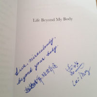 Title page with inscription from Lei Ming (Ray) that reads, "Live miraculously beyond your body" in English and Chinese above Ray's signature.